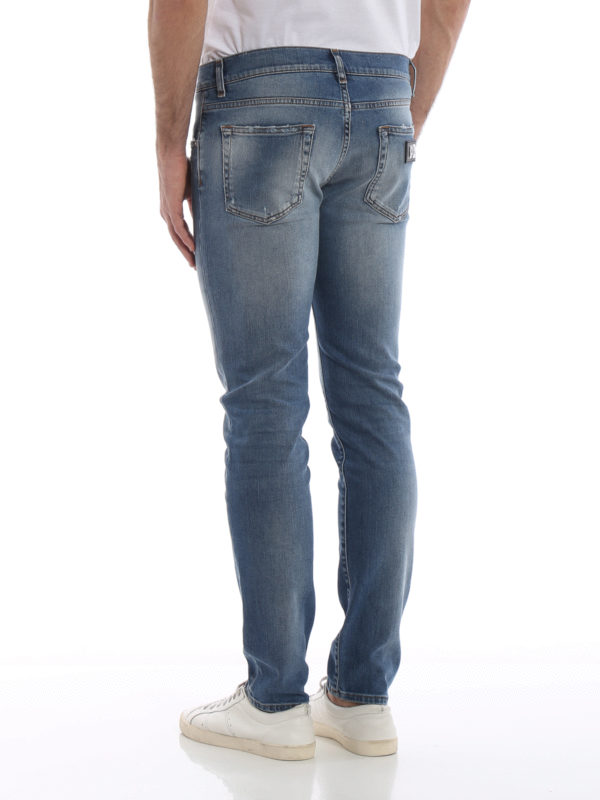Distressed denim stone washed jeans 