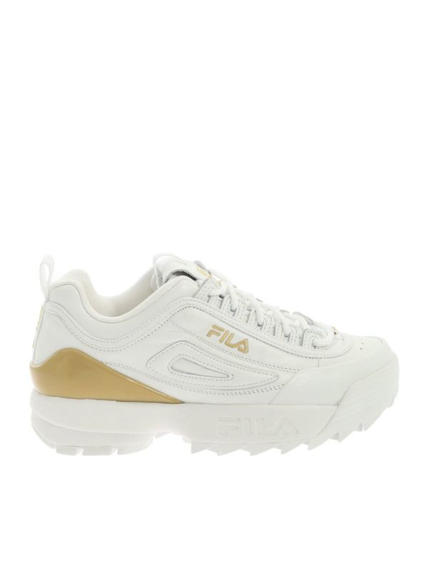 white and gold fila trainers