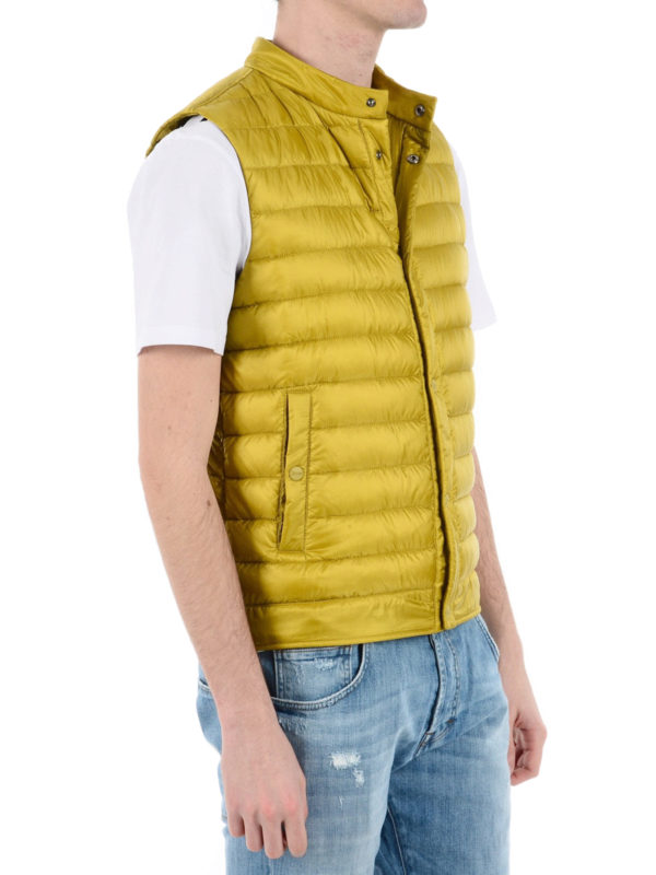 yellow sleeveless puffer jacket