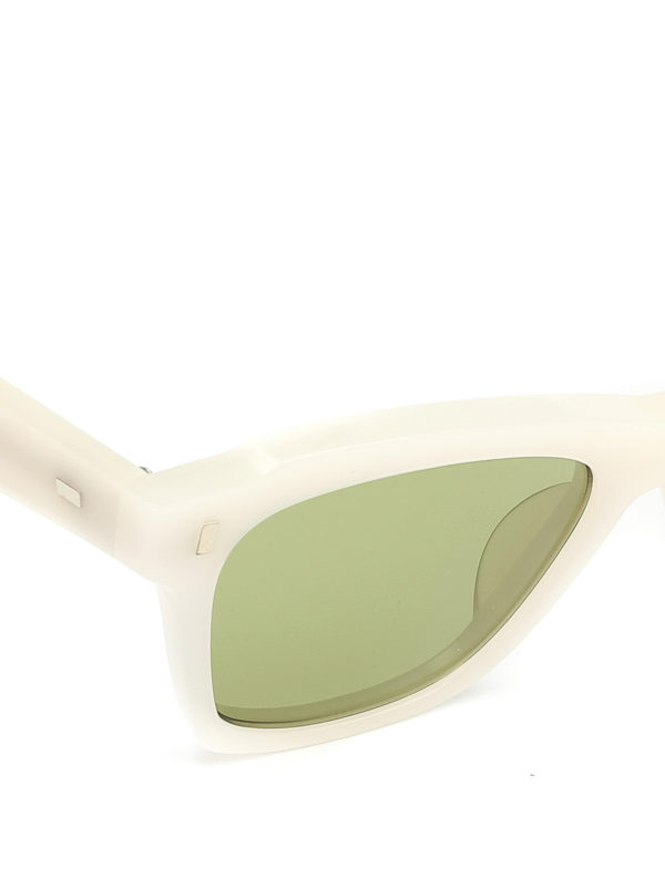 white sunglasses with green lenses