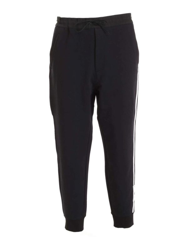 black tracksuit bottoms with white stripe