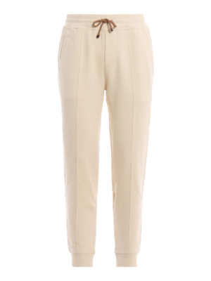 BRUNELLO CUCINELLI: pantaloni sport - Joggers color avorio in cotone felpato