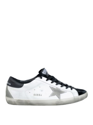 GOLDEN GOOSE: trainers - Superstar black and white sneakers
