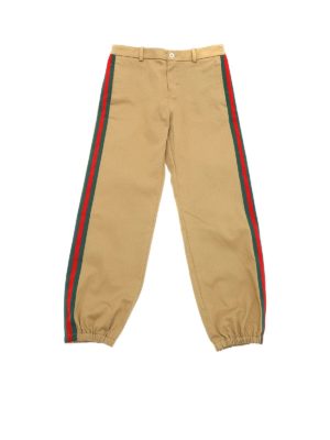 GUCCI: trousers - Camel-colored trousers with logo patch