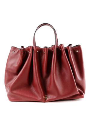 VALENTINO GARAVANI: shopper - Borsa shopping in pelle con logo e borchiette