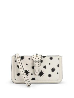 VALENTINO RED: pochette - Clutch in pelle stampa stelle con borchie