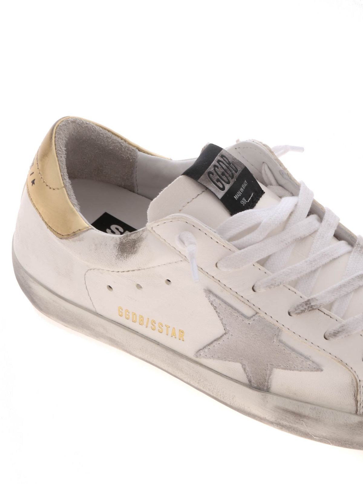 white superstar sneakers with gold heel tab