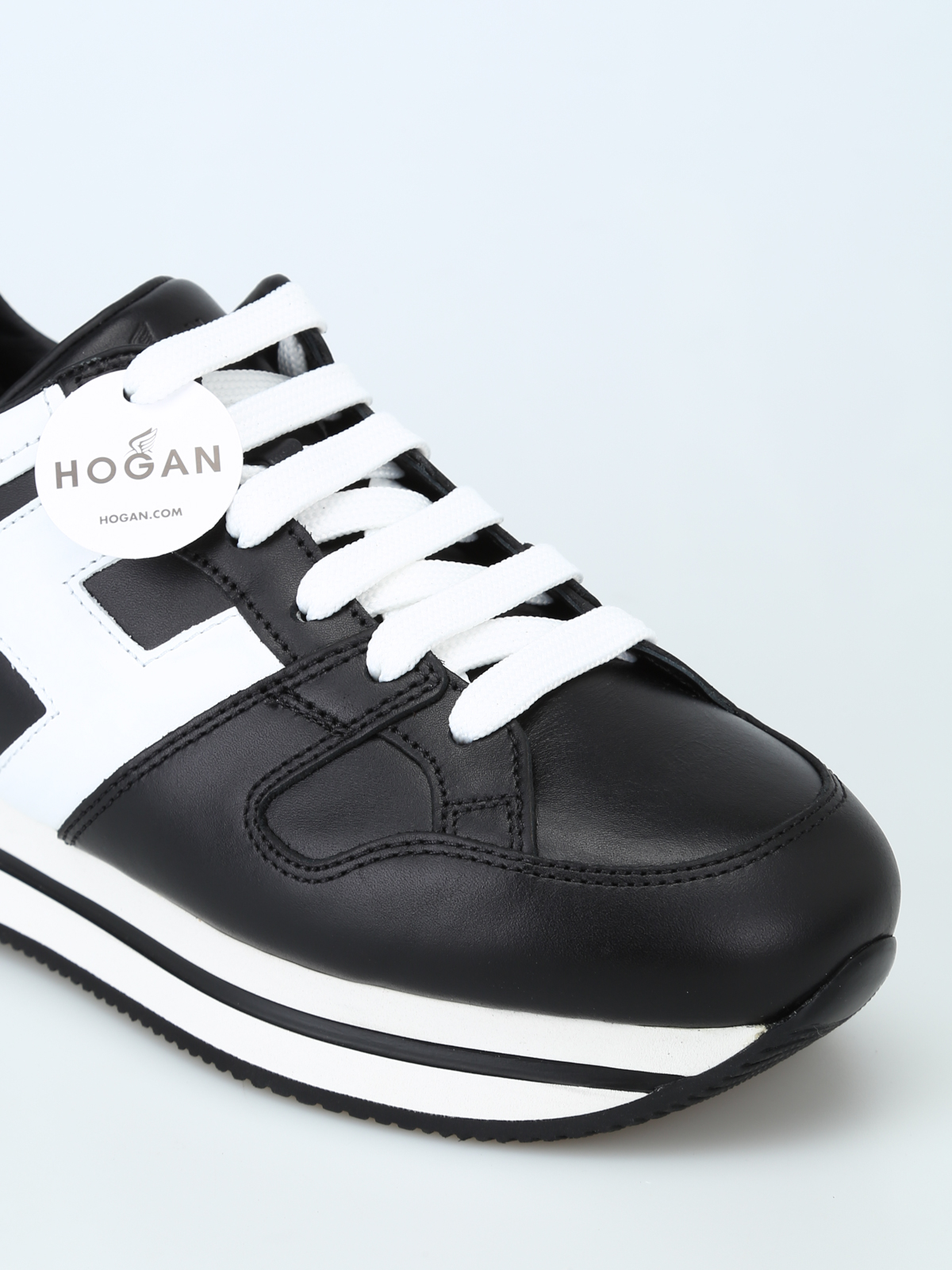 Hogan - Sneaker H222 nere e bianche in pelle - sneakers - HXW2220T548HQK0002