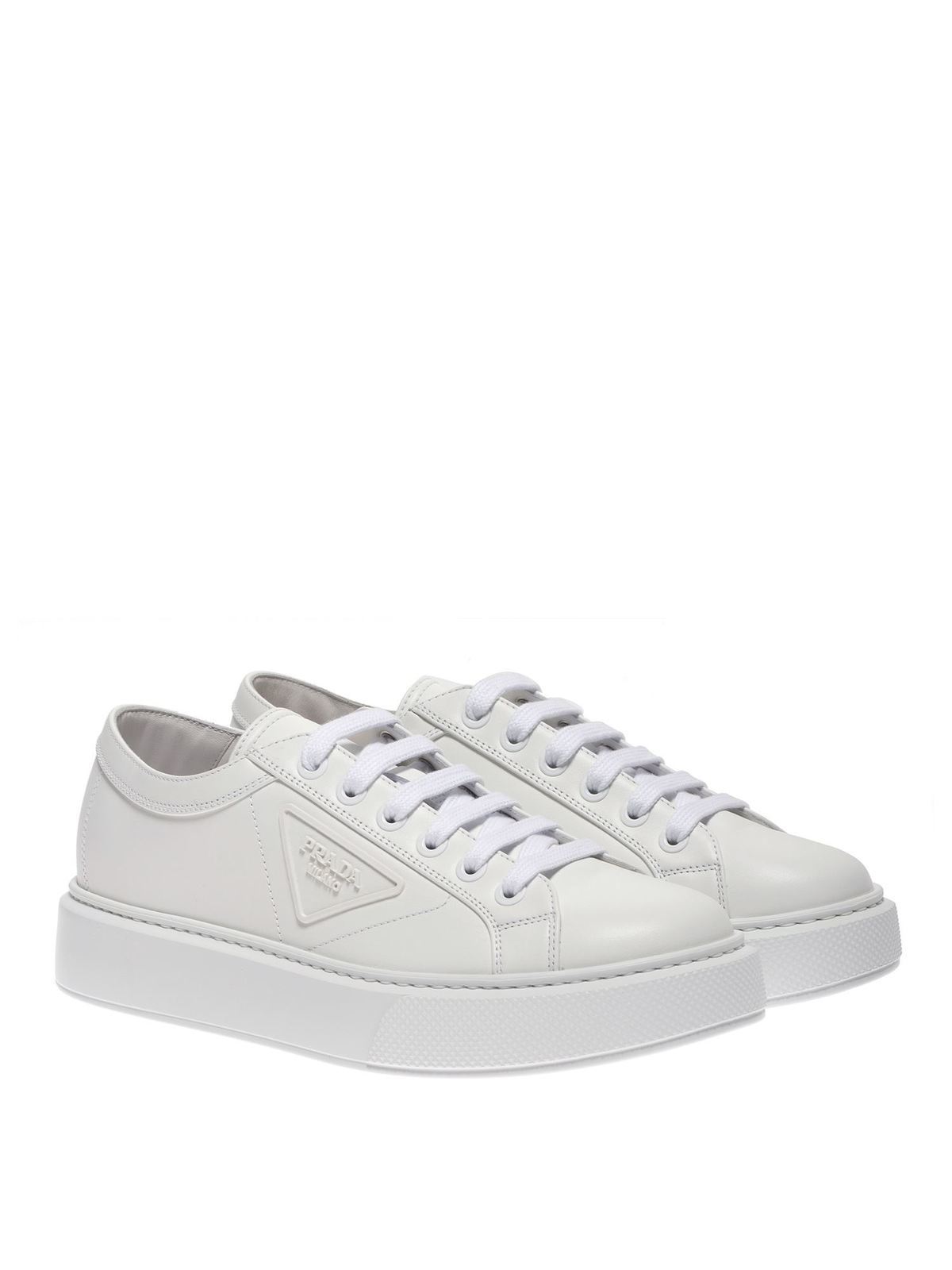 white branded trainers