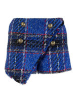 Shorts asimmetrici in tweed tartan
