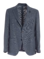 Giacca monopetto sui toni del blu con spilla