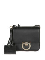 Borsa Lock in pelle con tracolla e nappa