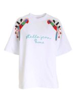 T-shirt bianca con maxi patch multicolor