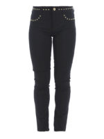 Pantaloni neri con borchie dorate